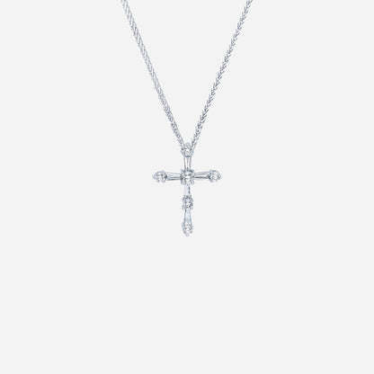 Cross diamond pendant in 18K white gold featuring tapered and round diamonds in a modern design. Chain not included.