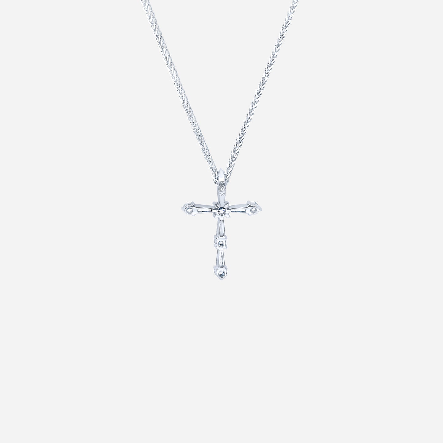 cross diamond pendant in 18k white gold with tapered and round diamonds, featuring a modern and simple design.