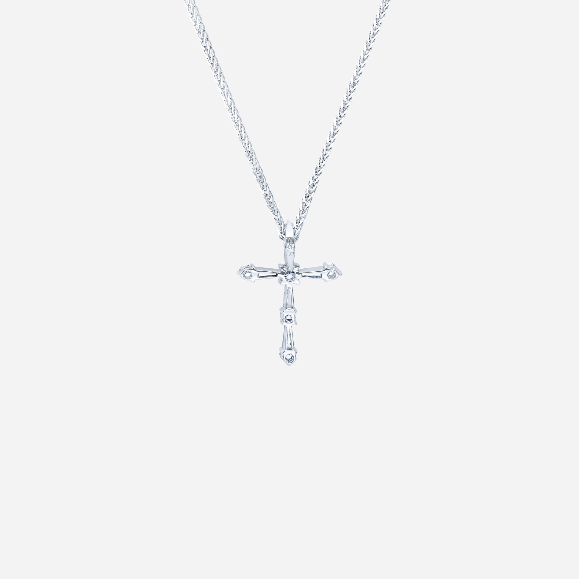 Cross diamond pendant in 18K white gold with tapered and round diamonds, featuring a modern and simple design.