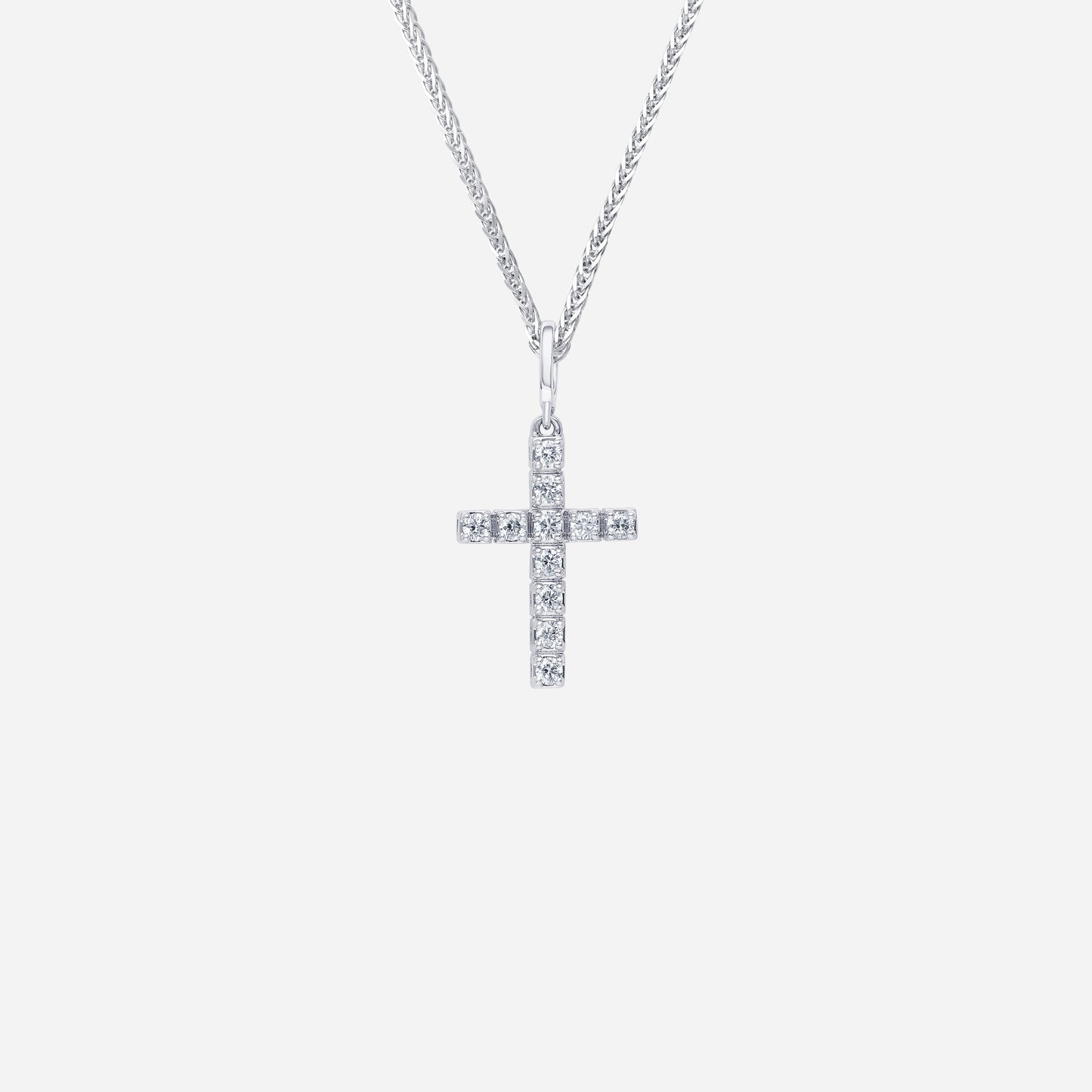 18k white gold cross pendant adorned with sparkling diamonds in a sleek, contemporary design. chain sold separately.