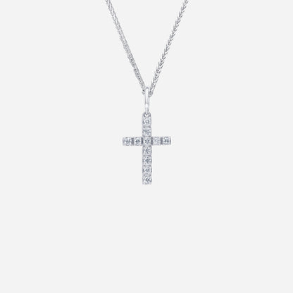 18K white gold cross pendant adorned with sparkling diamonds in a sleek, contemporary design. Chain sold separately.