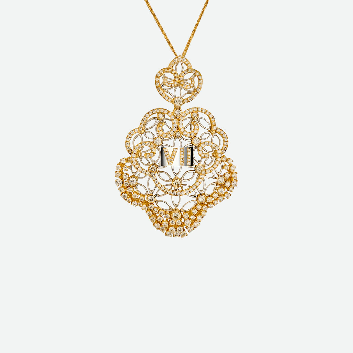 Couture Odyssey pendant in yellow and white gold with diamonds, featuring intricate design and Roman numeral VII.