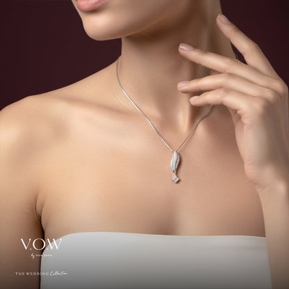 Shimmering cascade diamond pendant in 18K white gold with a flowing design and star-like drop. Elegant and refined.
