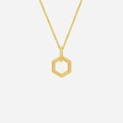 Hexagonal pendant in 18K yellow gold with a modern design, suspended on a delicate gold chain.