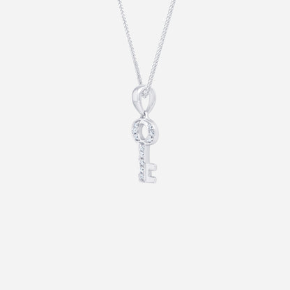 Key pendant in 18K white gold featuring a diamond-studded design, symbolizing dreams and memories.