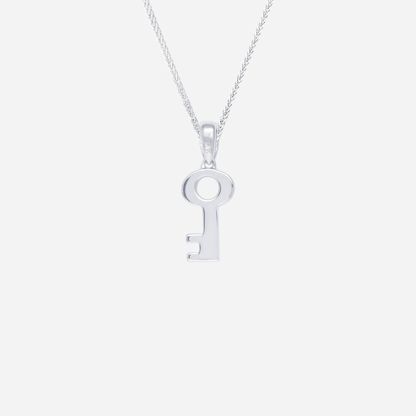 key pendant in polished 18k white gold, featuring a minimalist key design. chain sold separately.