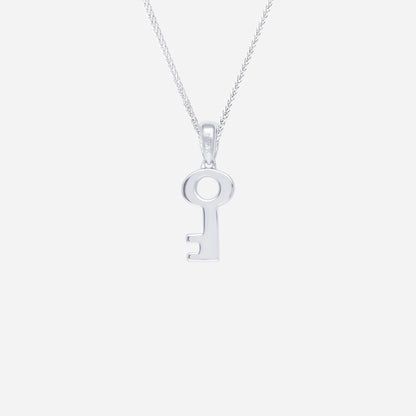 Key pendant in polished 18K white gold, featuring a minimalist key design. Chain sold separately.