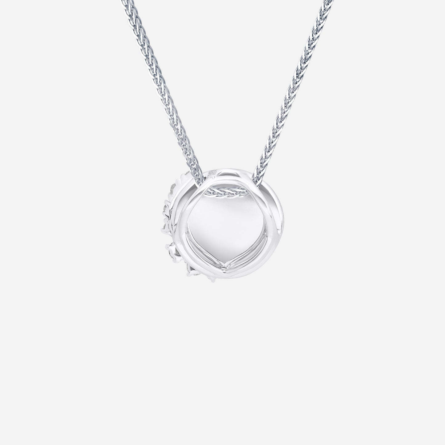 aurora cluster diamond pendant in 18k white gold with polished circular surface and asymmetrical diamond cluster design.