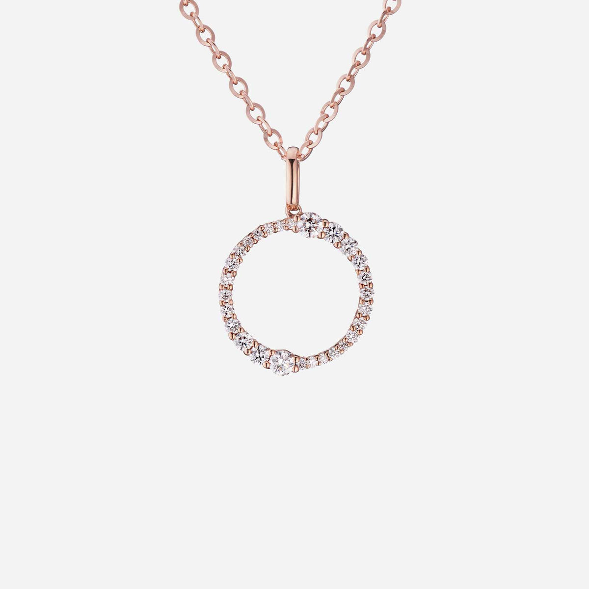 Halo diamond pendant in 18K rose gold featuring a circular design with brilliant diamonds. Perfect symbol of love.