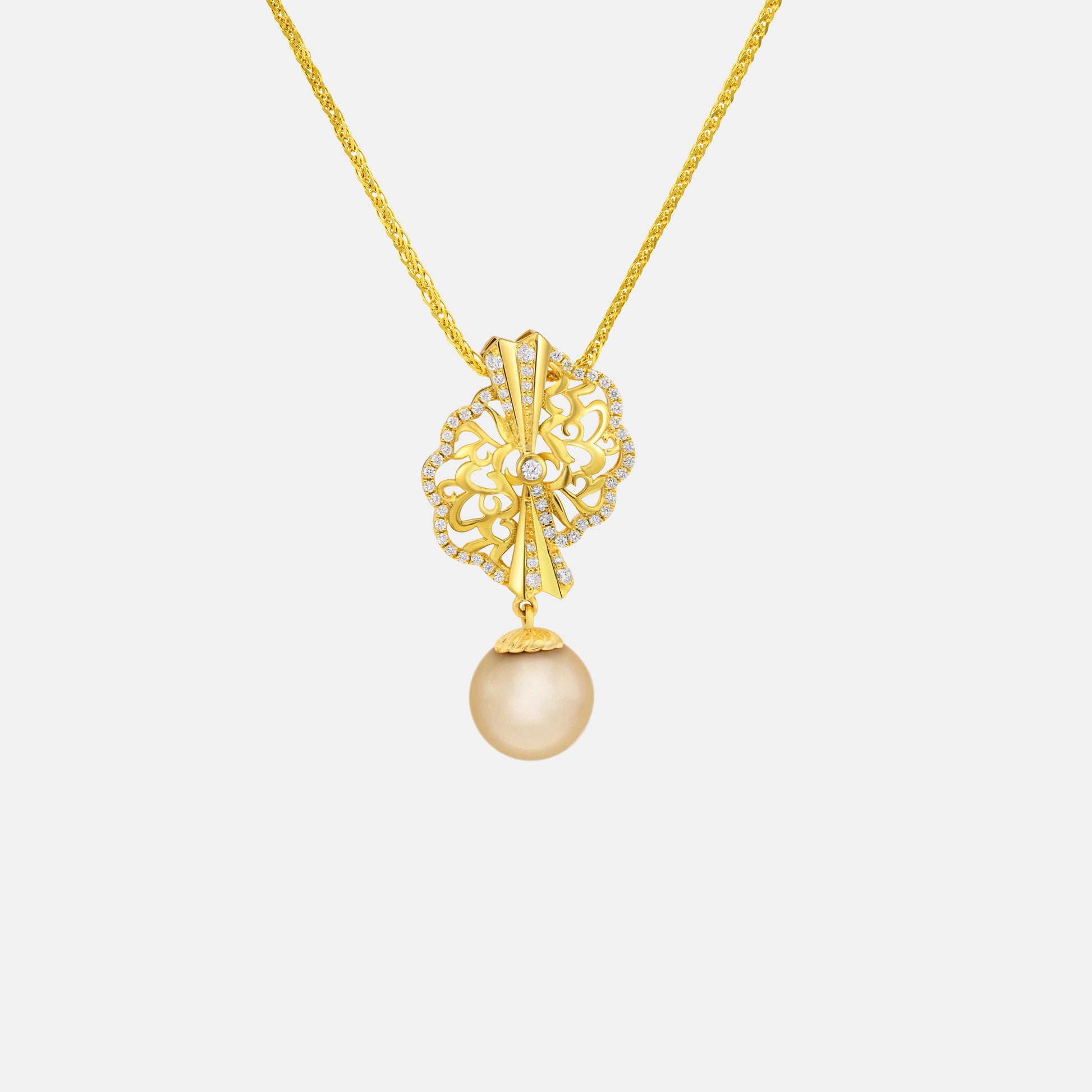 Legacy South Sea Pearl pendant with diamond in intricate yellow gold fan design, featuring a lustrous golden pearl drop.