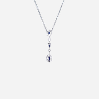 Blue sapphire pendant with diamond accents in 18K white gold, featuring a cascading design and oval gemstones.