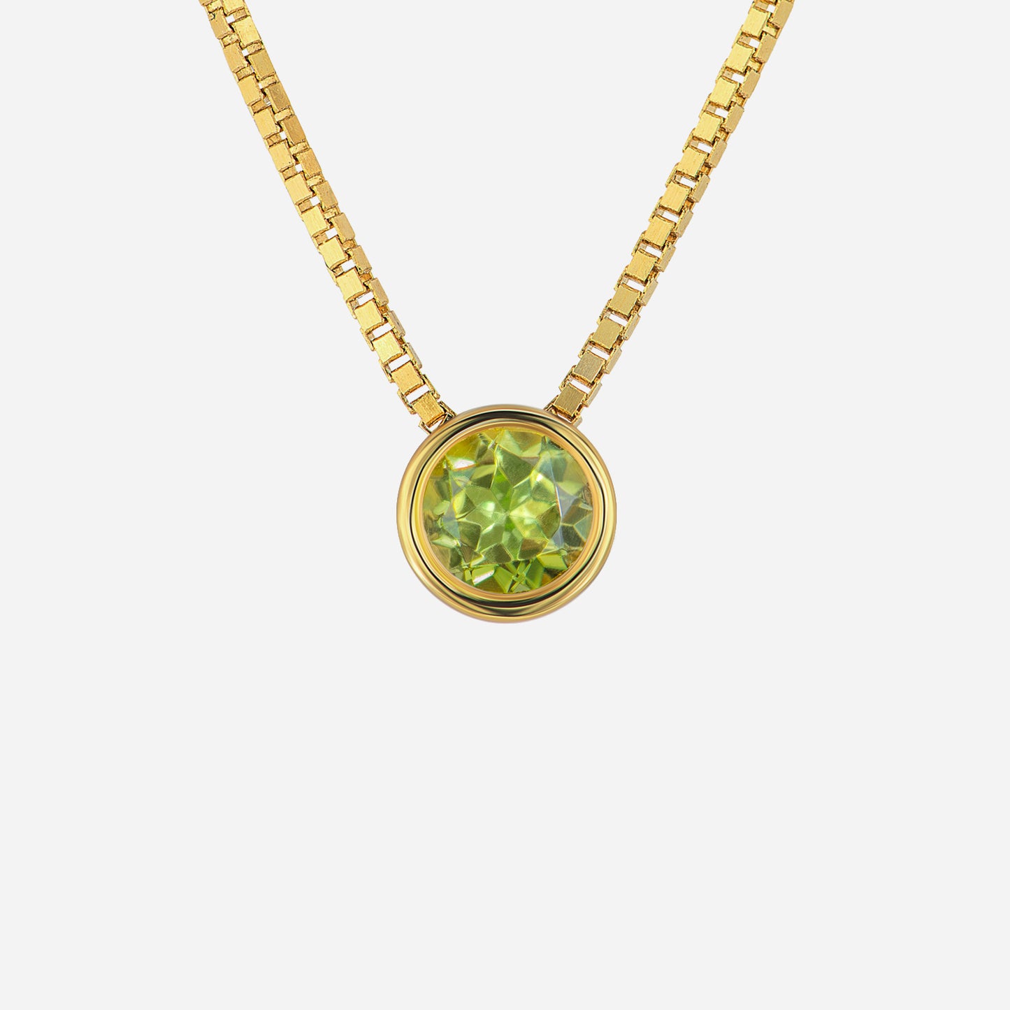 peridot pendant set in 18k yellow gold, featuring a round cut gemstone on a stylish chain design.