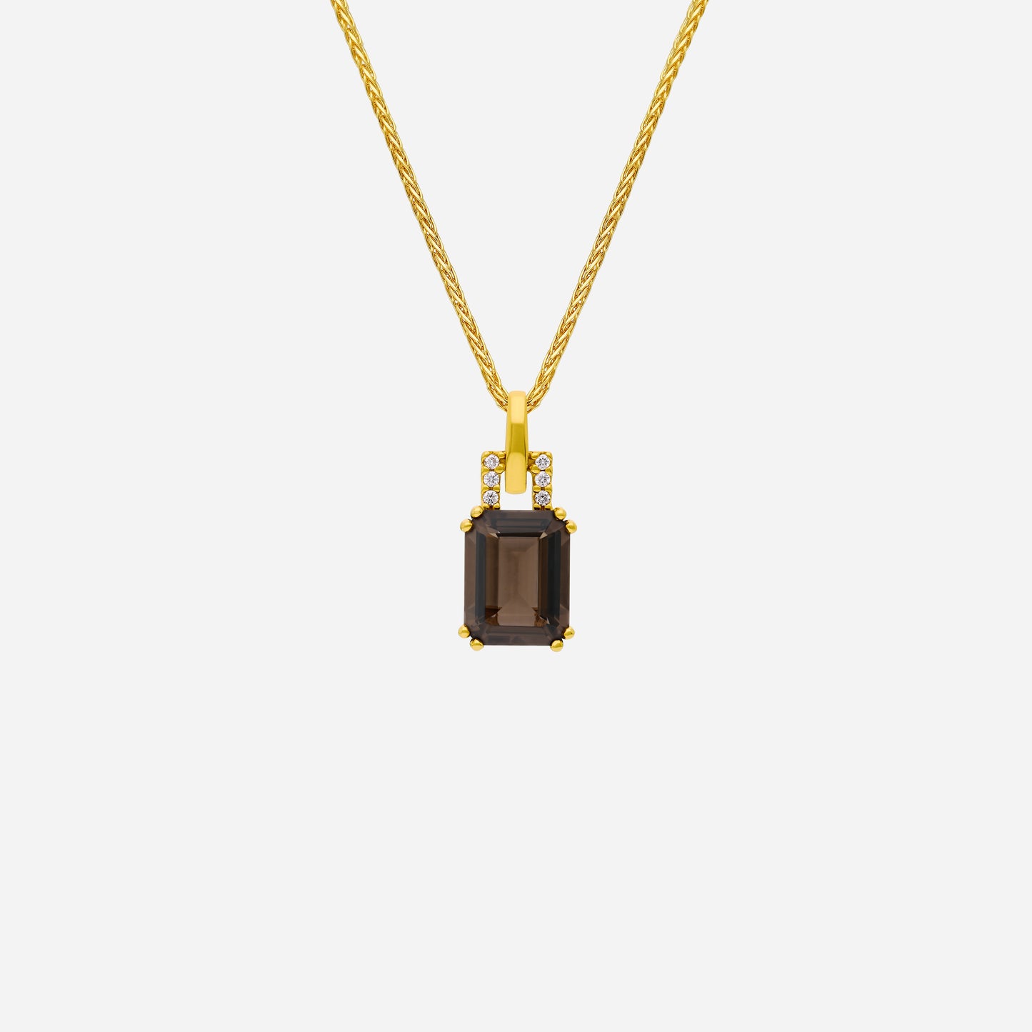luxe smoky quartz pendant with diamonds set in 18k yellow gold on a twisted chain. elegant and refined design.