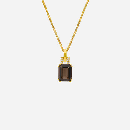 Luxe smoky quartz pendant with diamonds set in 18K yellow gold on a twisted chain. Elegant and refined design.