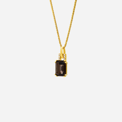 Luxe yellow gold pendant featuring a rectangular smoky quartz and radiant diamond accents. Elegant and refined design.