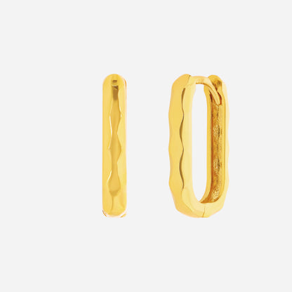 Curved Huggie Earrings in 22K Yellow Gold with a minimal, fluid design showcasing a soft curve.