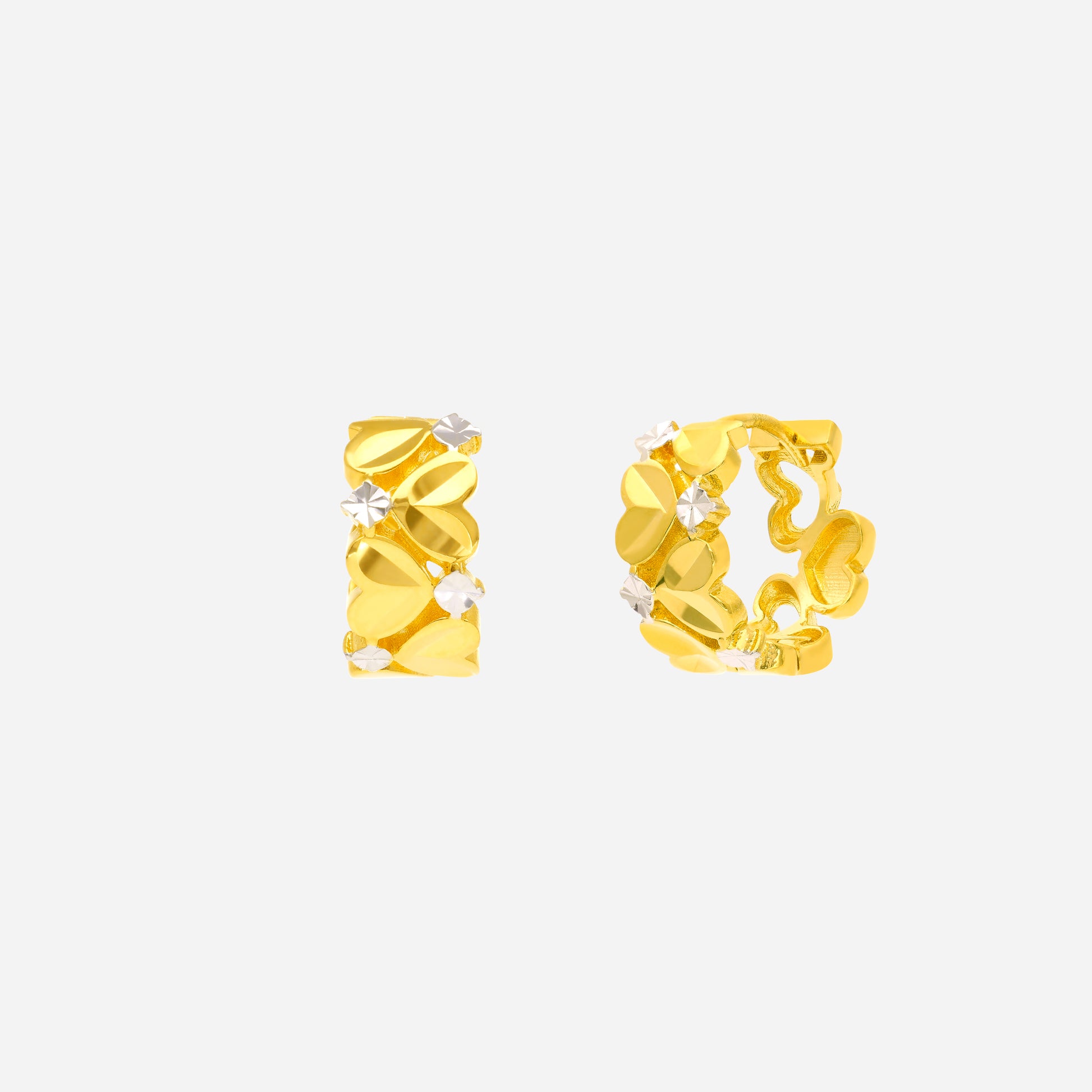 Braided twist hoop earrings in yellow and white gold with heart motifs and white gold accents.