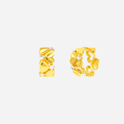 Braided twist hoop earrings in yellow and white gold with heart motifs and white gold accents.