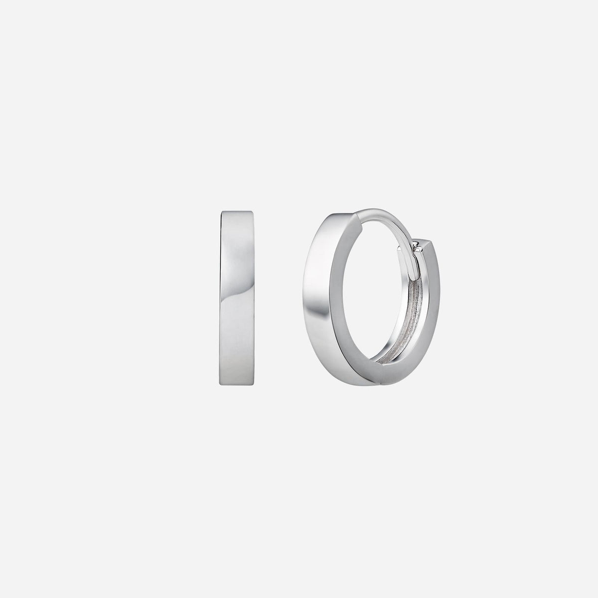 huggie earrings in 18k white gold with a minimalist design, perfect for any outfit.