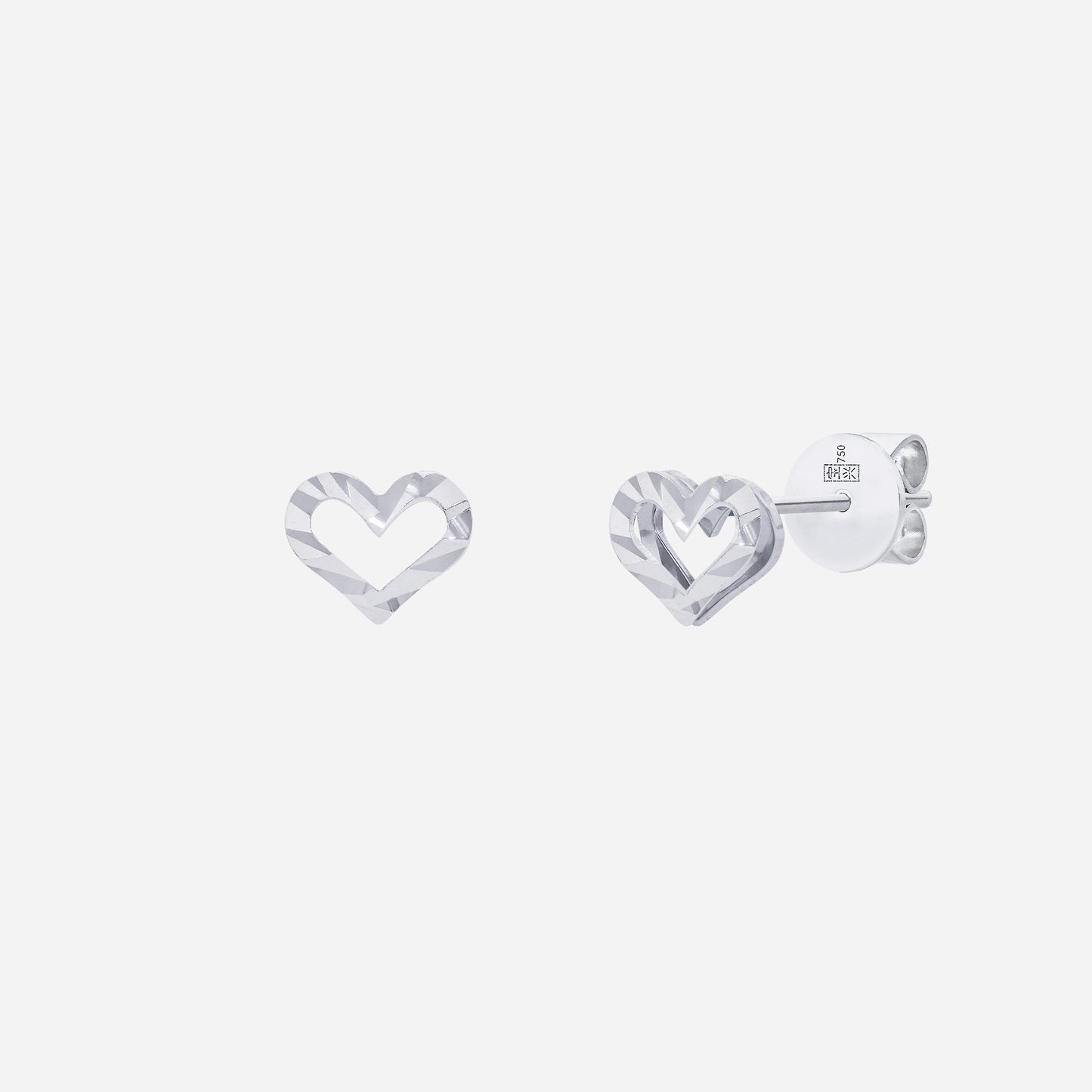 heart earrings in 18k white gold with a modern cut-out design, reflecting a timeless love motif.