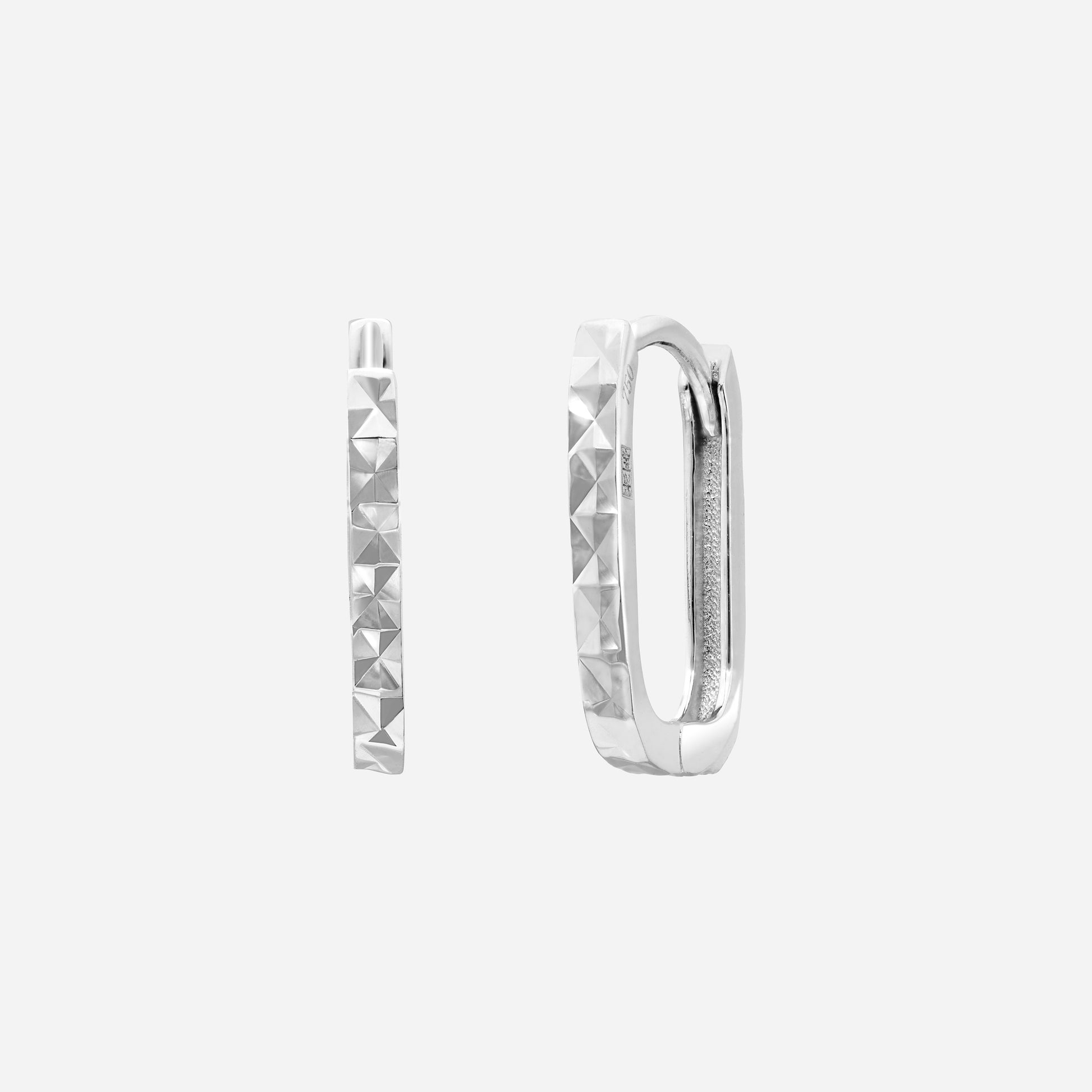 Huggie earrings in 18K white gold featuring a sleek design with diamond-cut facets for subtle brilliance.