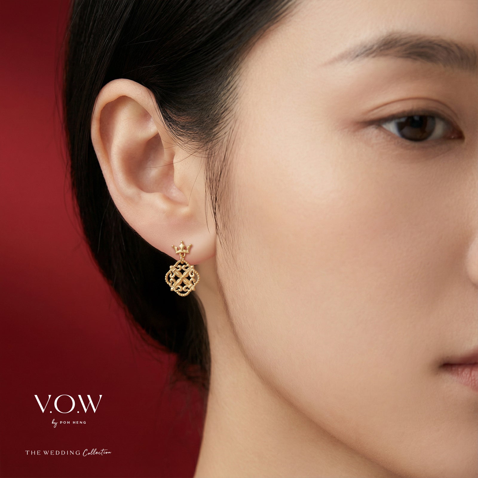 Euphorbia earrings in 24K yellow gold with intricate design, worn elegantly in a model's ear.