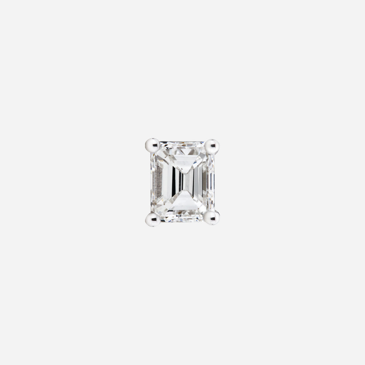 Emerald cut diamond stud earring in 18K white gold with a sleek and elegant design. Perfect for layering or solo wear.