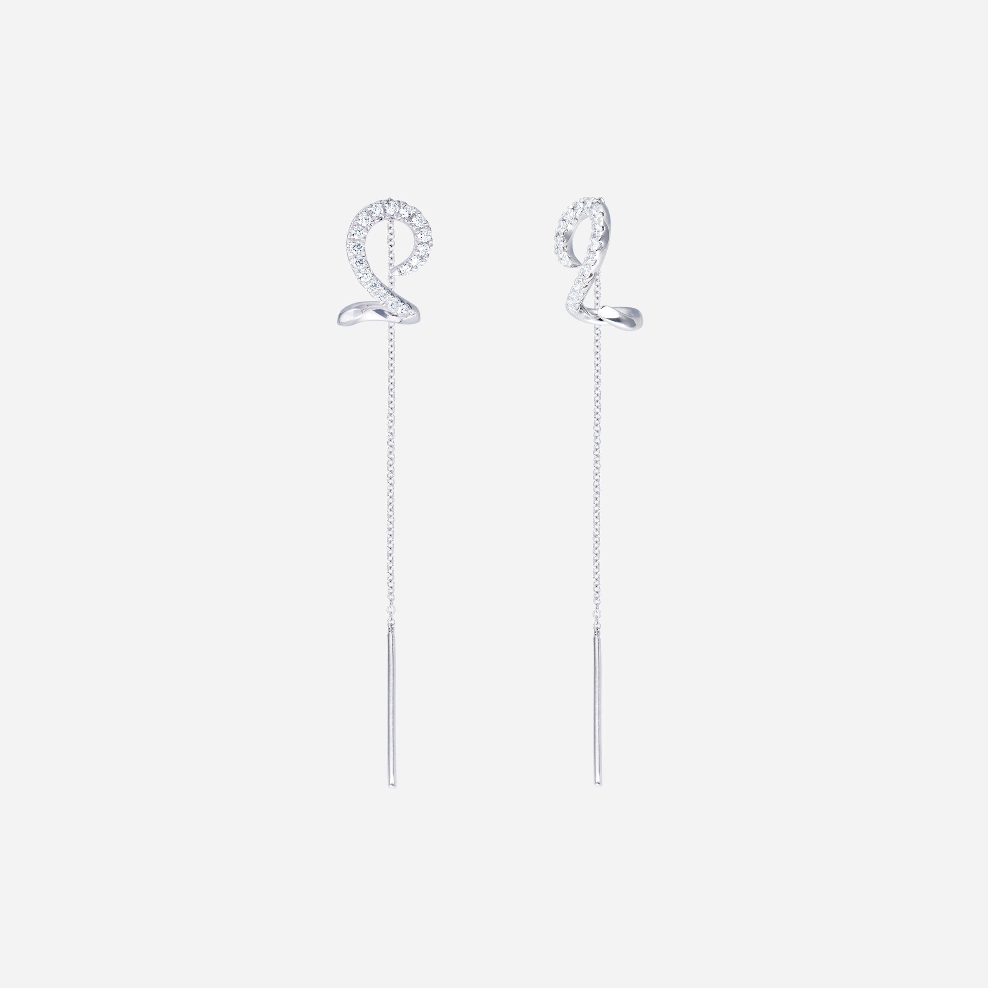 Linear shimmer diamond earrings in 18K white gold with spiral design and slender threader chains, featuring diamond accents.