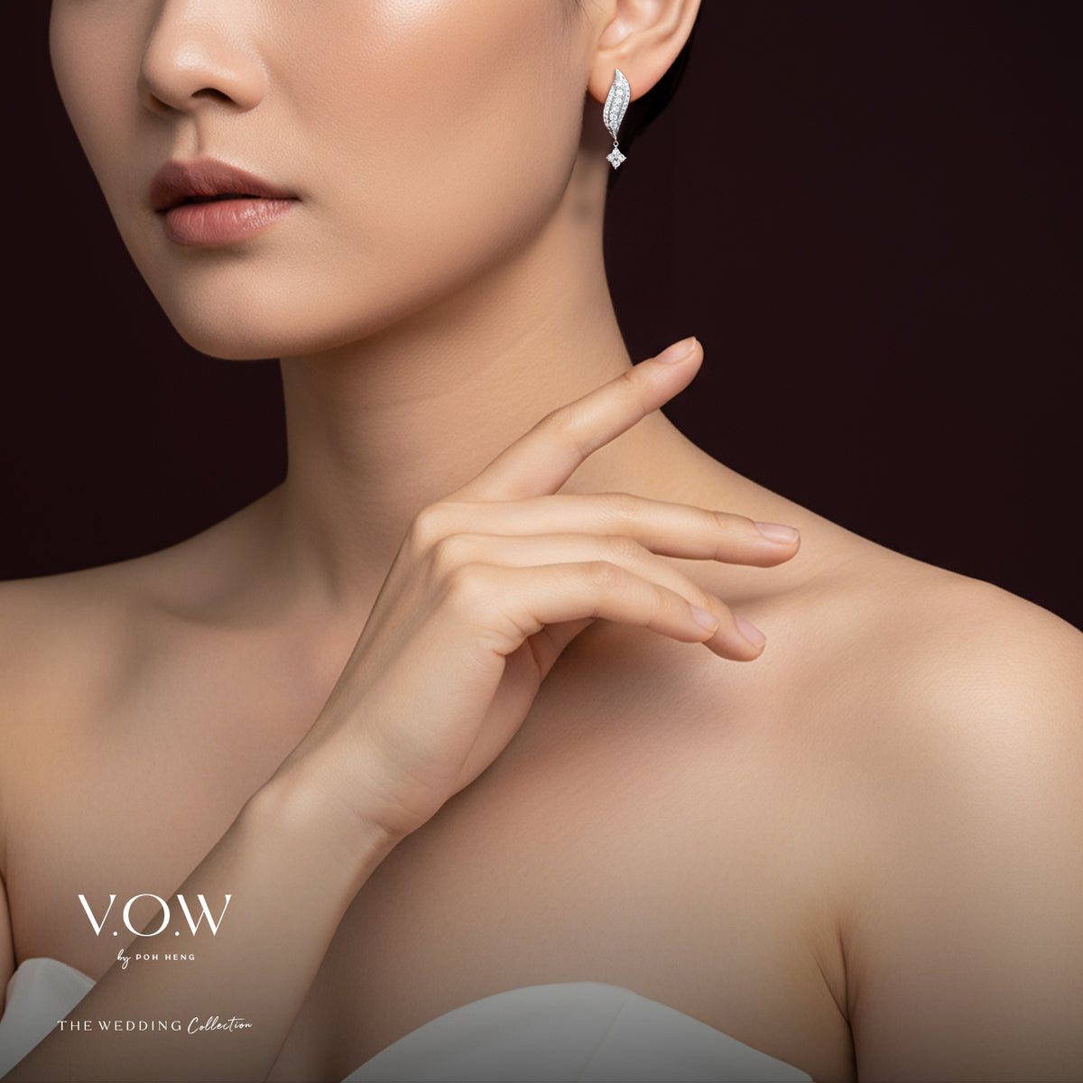 shimmering cascade diamond earrings in 18k white gold, featuring flowing curves and elegant diamond accents.