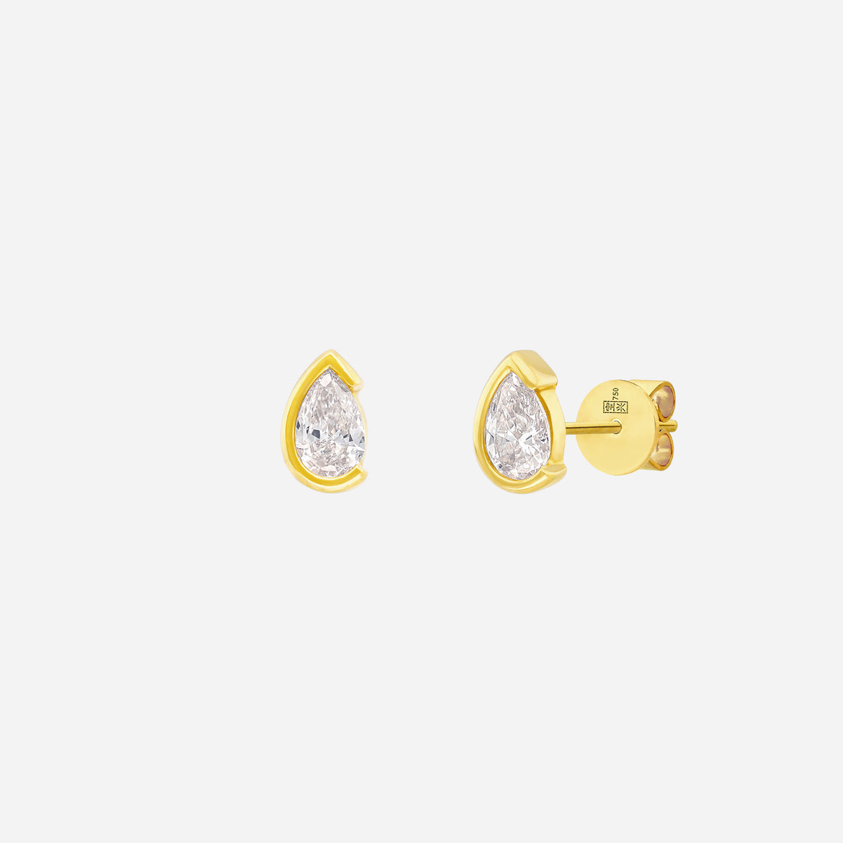 Light Embrace Pear Diamond Earrings in 18K yellow gold with pear-cut diamonds in sleek bezel design.