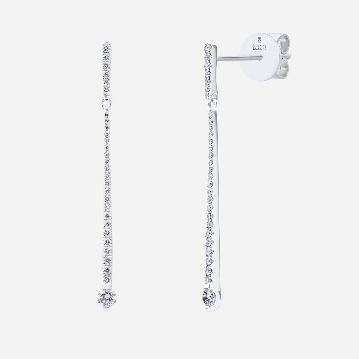 Elongated diamond earrings in 18K white gold with sparkling gemstones, featuring a vertical line design.
