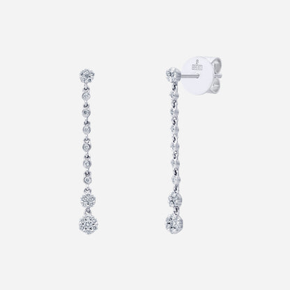 Chandelier diamond earrings in 18K white gold with cascading clusters and floral-inspired design.