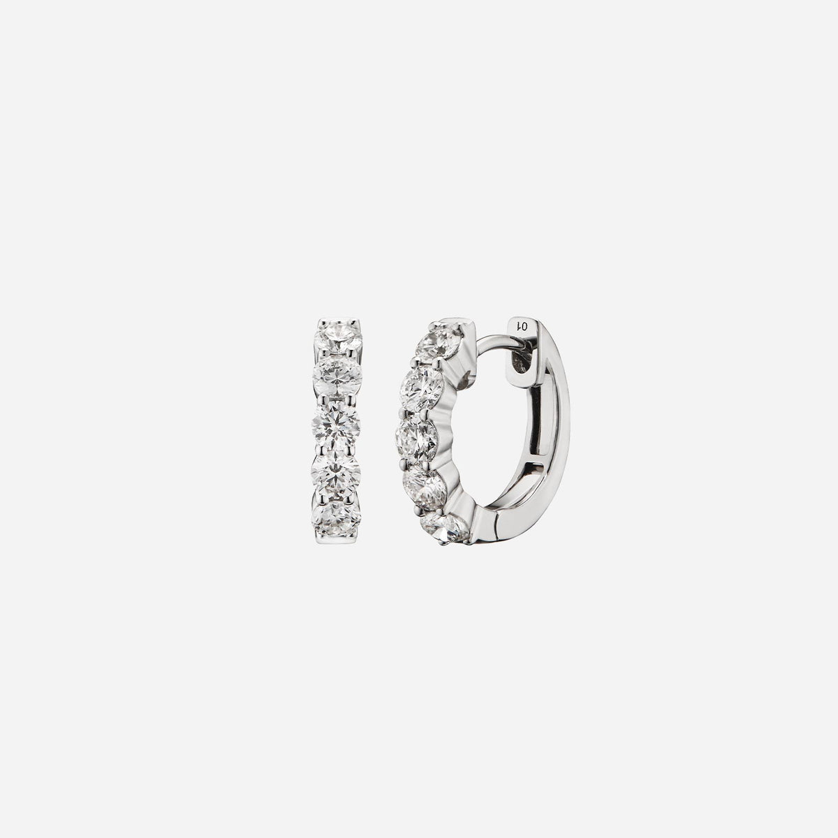 Diamond huggie earrings in 18K white gold featuring round brilliant diamonds totaling 1.0 carat with a sleek design.