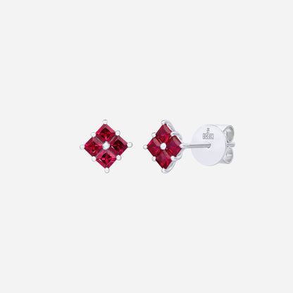 Princess-cut ruby earrings in 18K white gold with a diamond-shaped design and vivid red brilliance.