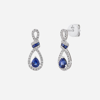 Dewdrop blue sapphire earrings in 18K white gold with diamond accents, featuring a graceful pear-shaped design.