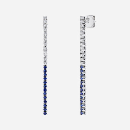 Blue sapphire and diamond earrings in 18K white gold with a sleek linear design and vibrant blue stones.