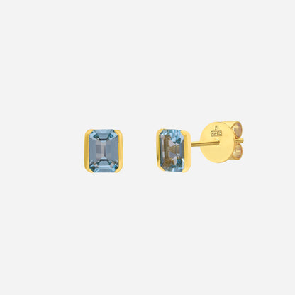 Simplicity earrings featuring sky blue topaz gemstones set in 18K yellow gold with elegant rectangular design.